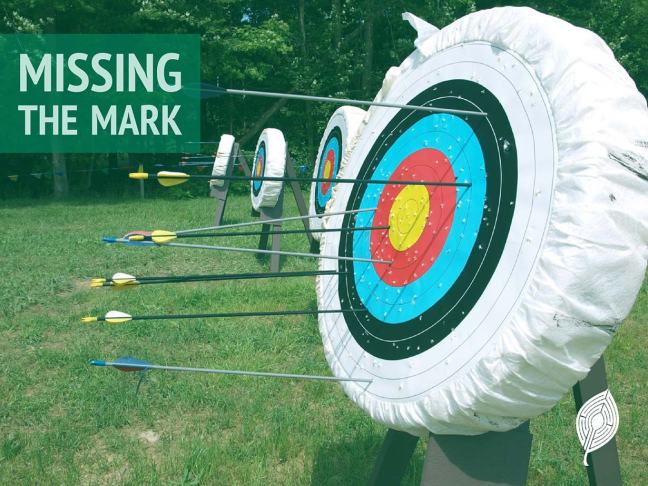 Featured image for this post; arrows in a target